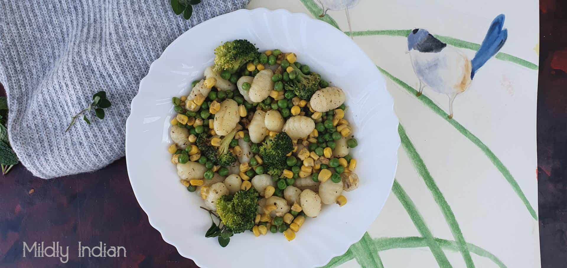 Pan roasted gnocchi with peas, broccoli and corn